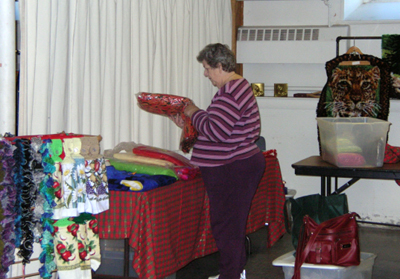 Laurice arranges crafts and knitted goods